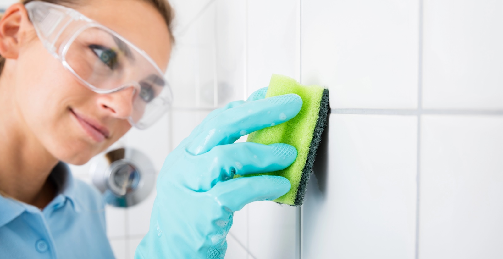 Tile and grout being cleaned
