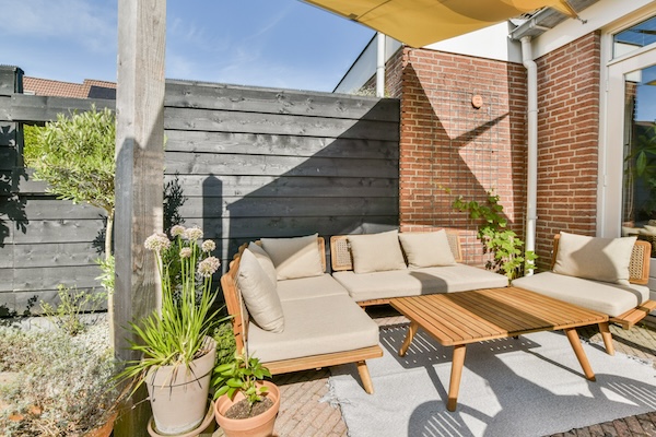 Professionally Cleaned Patio furniture looking bright and like new on outdoor patio